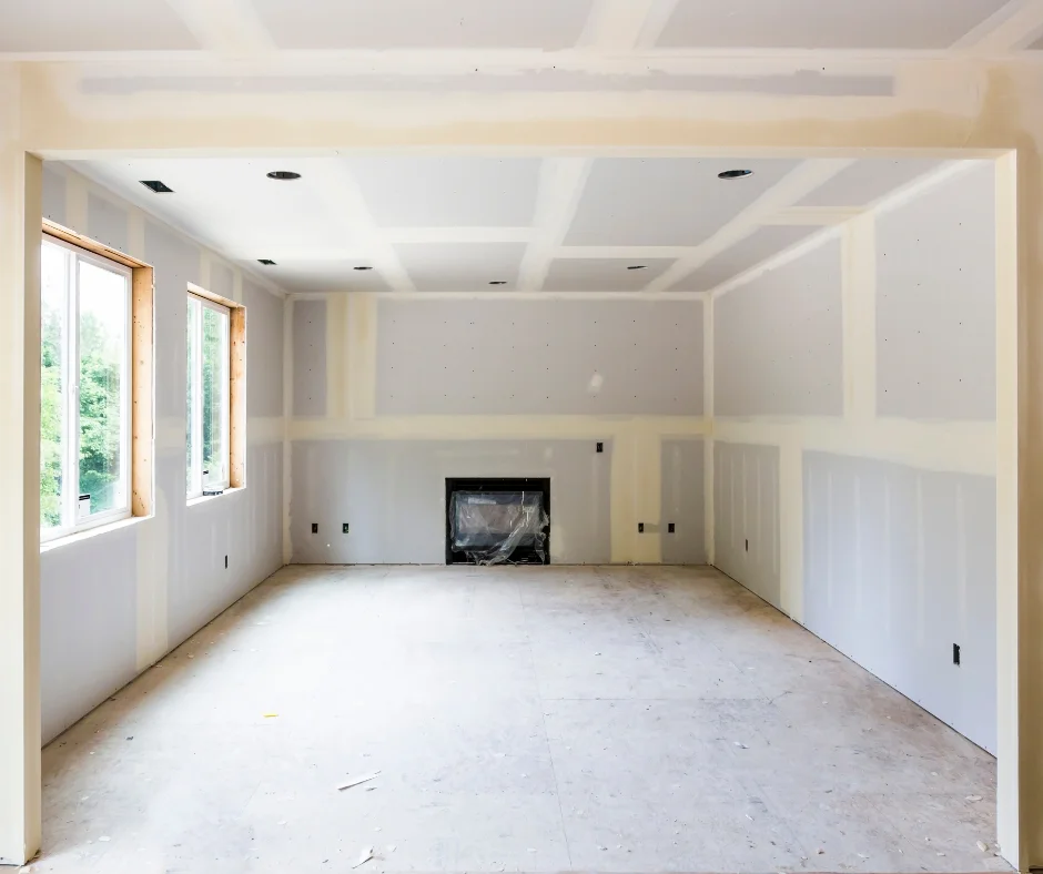 An interior with newly installed drywall, ready for finishing